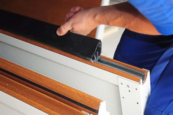 How Do I Replace the Rubber Strip on the Bottom of My Vinyl Garage Door?
