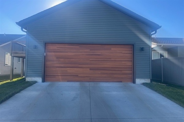How Do You Choose the Right Garage Door Material (Steel, Wood, Composite) for Your Home?